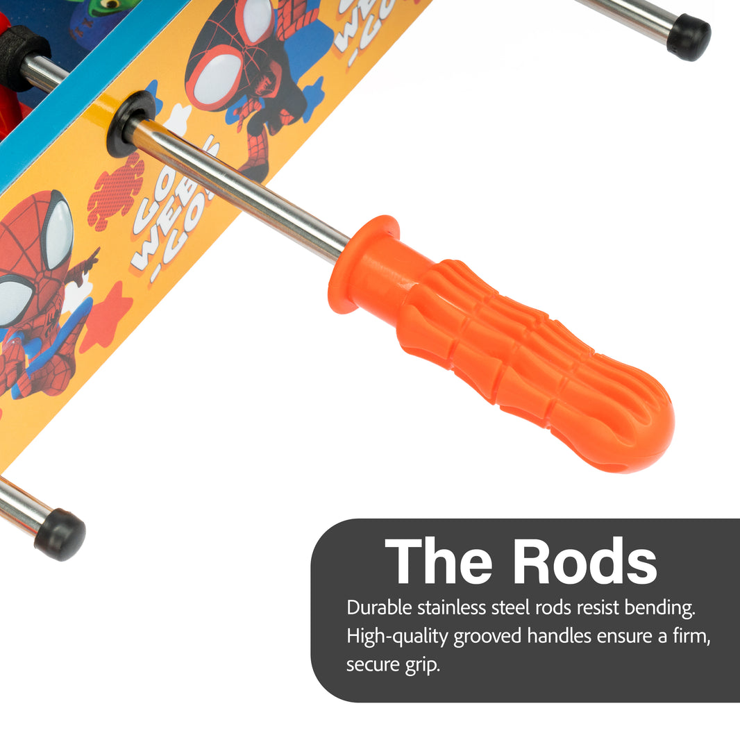 Close-up of a table football rod with an orange handle and Spider-Man design on the table.