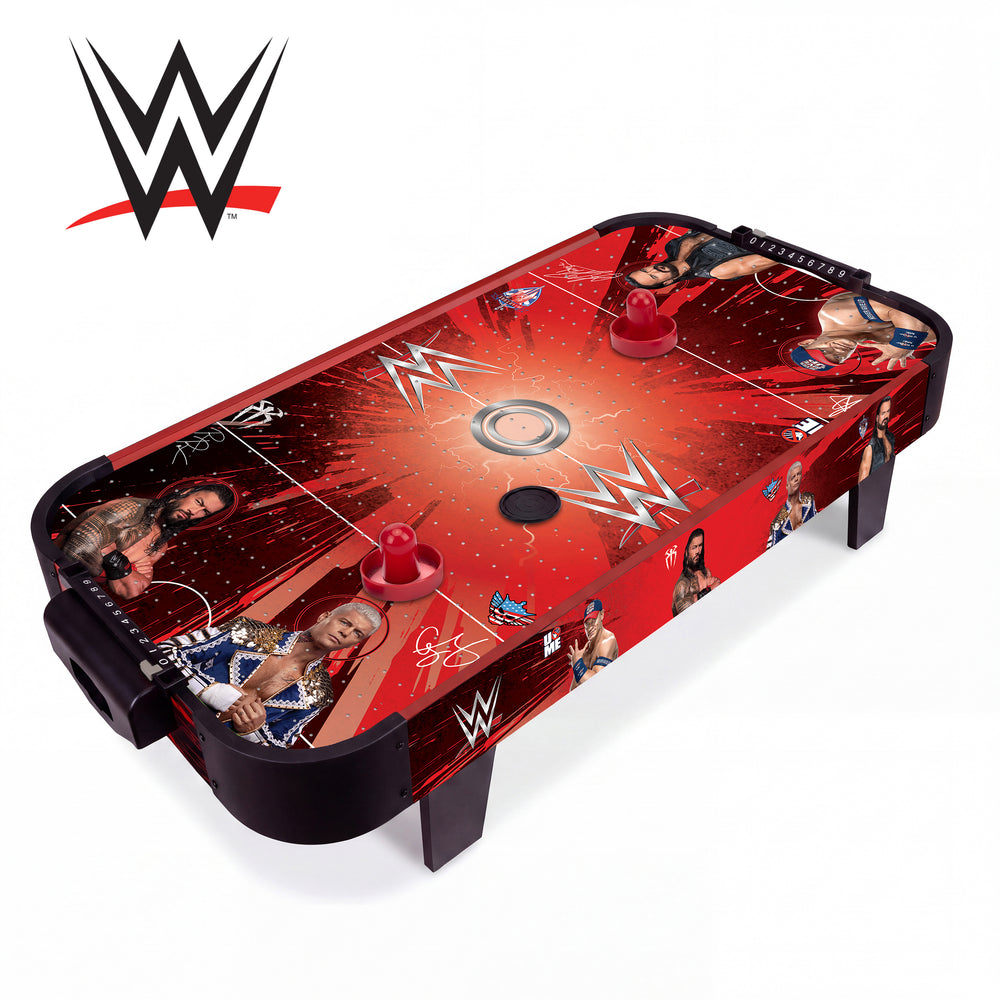 A WWE-themed air hockey table with a red and black graphic design featuring wrestler photos and logos, shown on a white background with a WWE logo in the top-left corner.