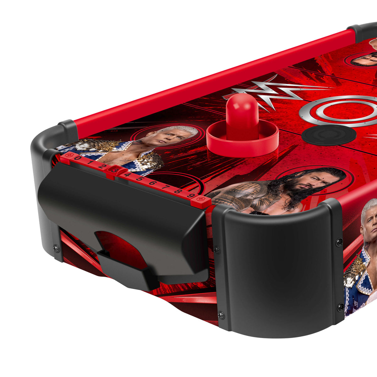 A WWE-themed air hockey table featuring red and black graphics with WWE branding and wrestler imagery, shown on a clean white background.
